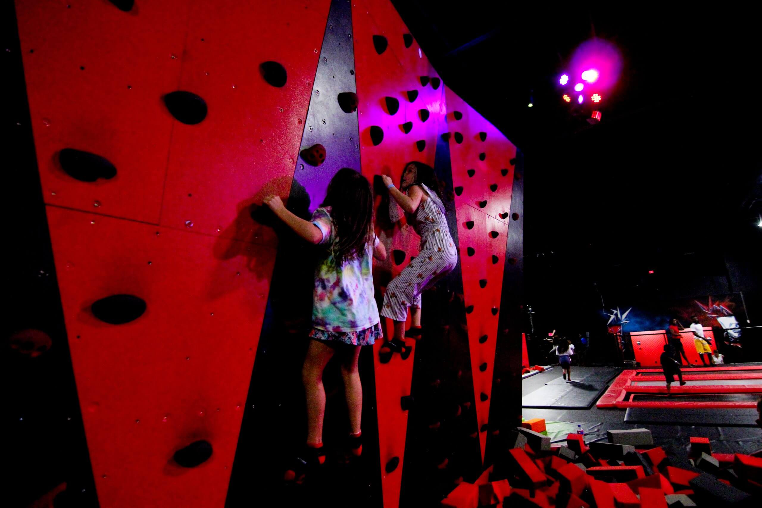 kids on a rock climbing wall
